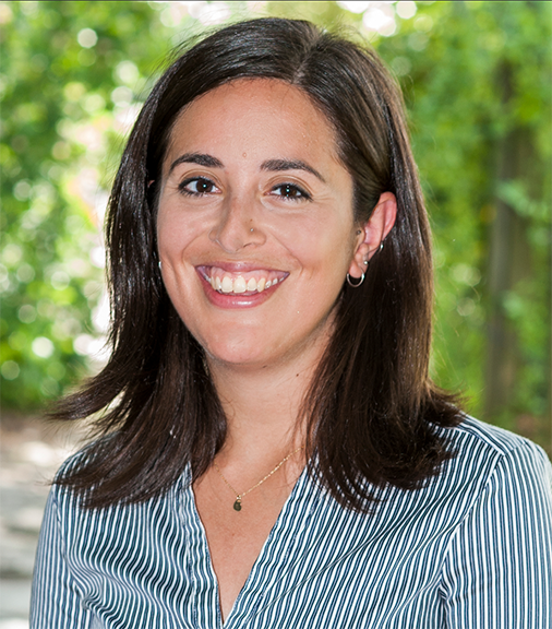 A portrait photo of Liani with trees in the background