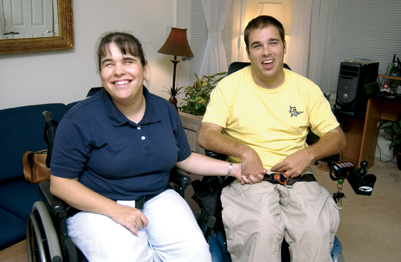 Couple with disabilities in wheelchairs