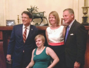 FIFNC Executive Director Betsy MacMichael with daughter Janie Desmond, former Governor Pat McCrory and Senator Richard Burr at the 2015 signing of the ABLE Act. 