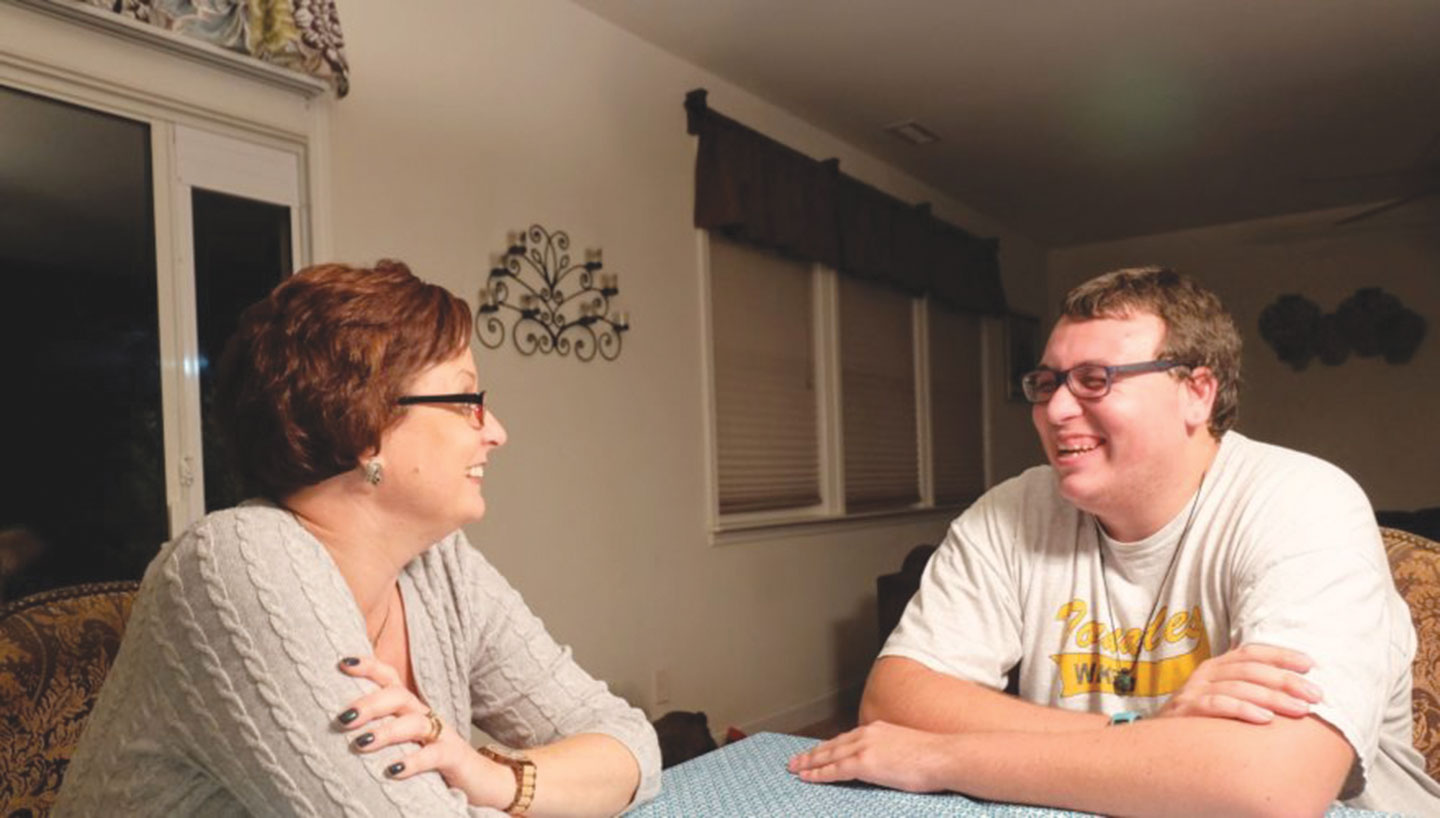 Kristine and Shawn Stead share a laugh at their home in Garner. 