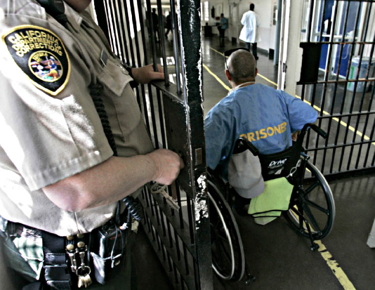 a man in a wheelchair is leaving prison