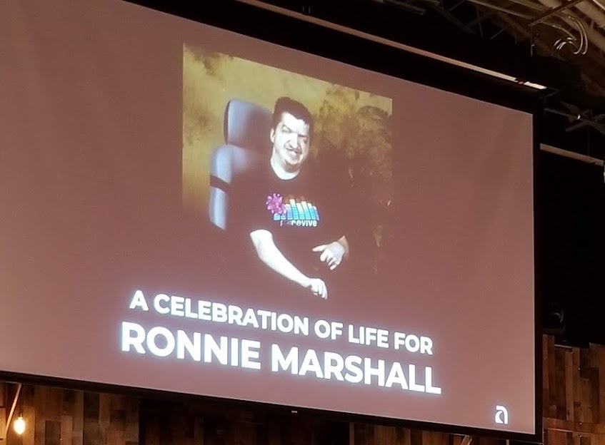 Projector Screen Showing Memorial Photo of Ronnie Marshall