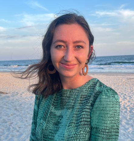 Photo of Jacklyn Boheler standing on an ocean shore